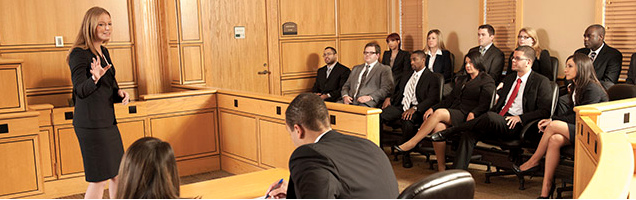 a woman speaking to a jury